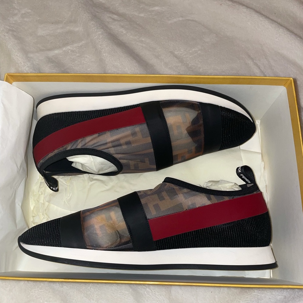 Fendi Roma sneakers w/ Fendi logo all over and red stripe .